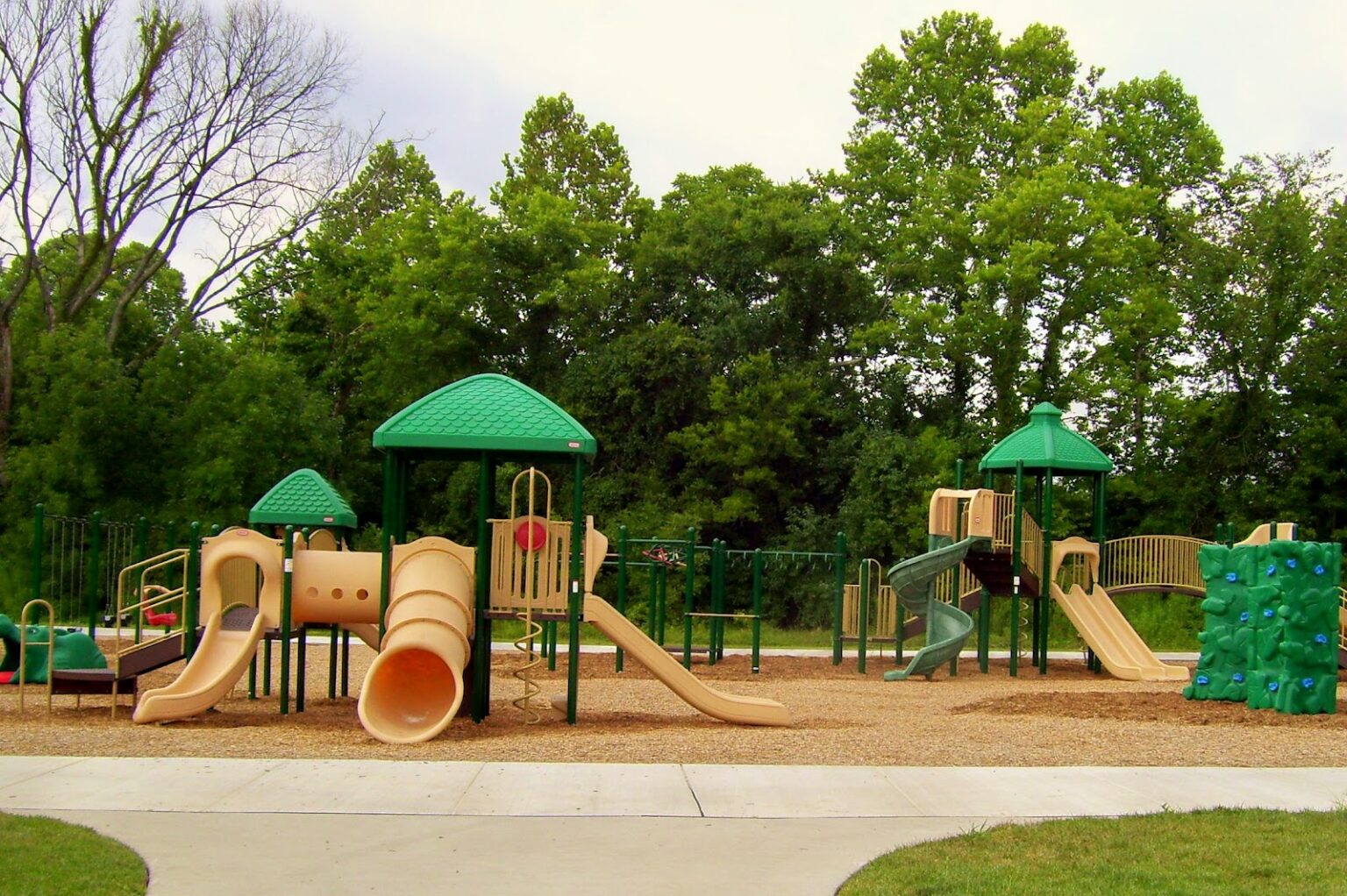 Playground area in Colwyn, PA with play structures and open green space.