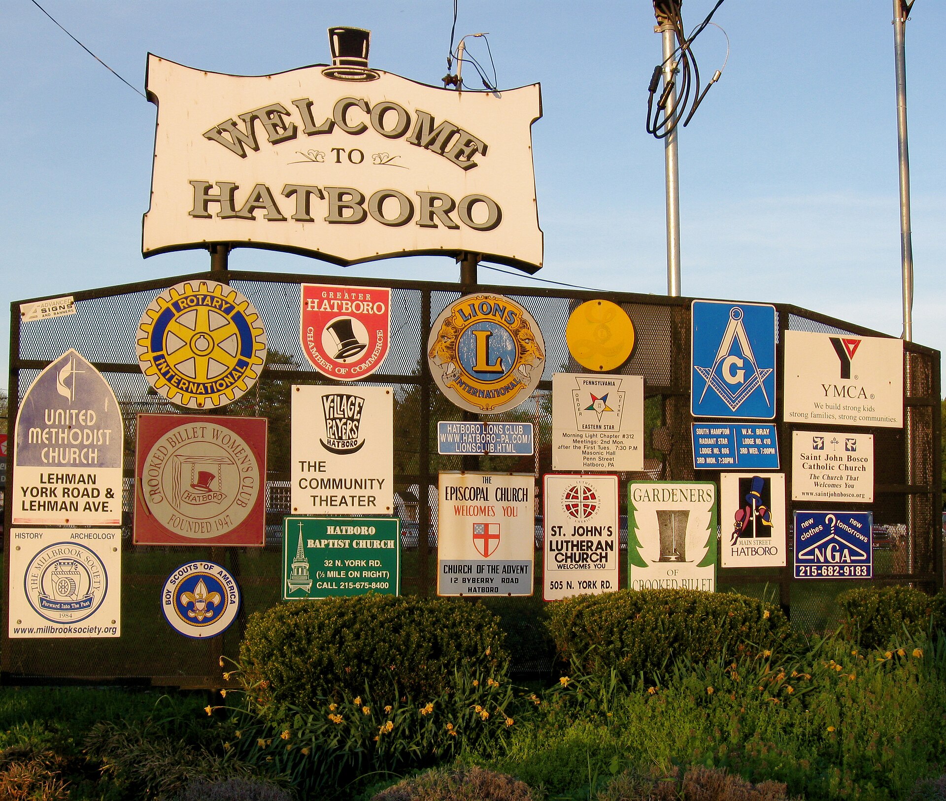 Welcome_To_Hatboro Welcome sign marking the entrance to Hatboro, Pennsylvania, surrounded by landscaping and greenery.